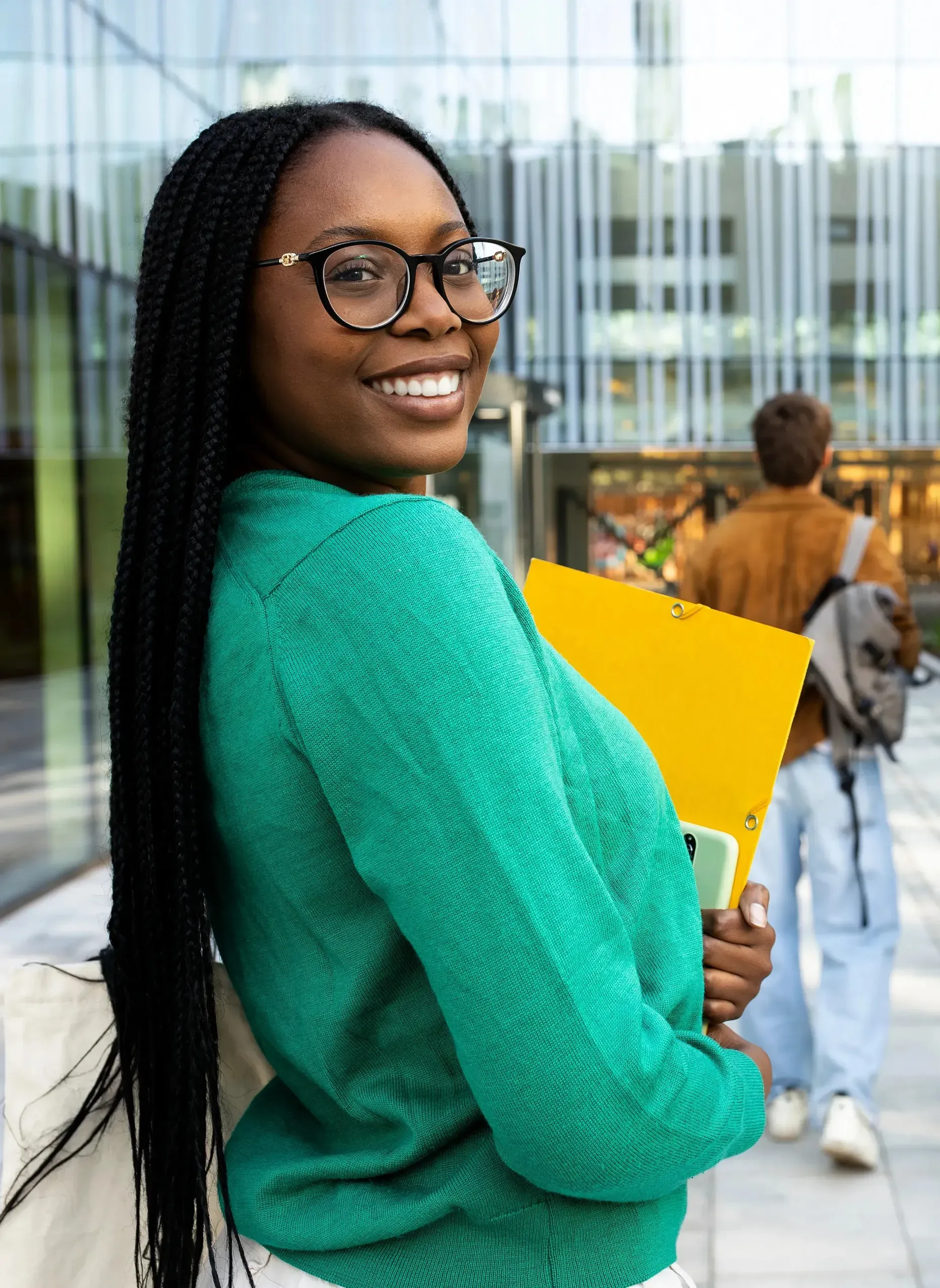 Student on a university campus with classmates