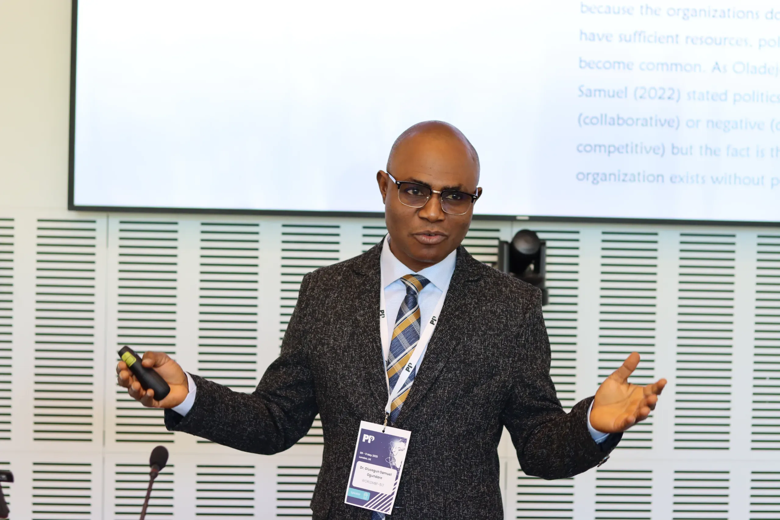 Speaker presenting to a conference audience