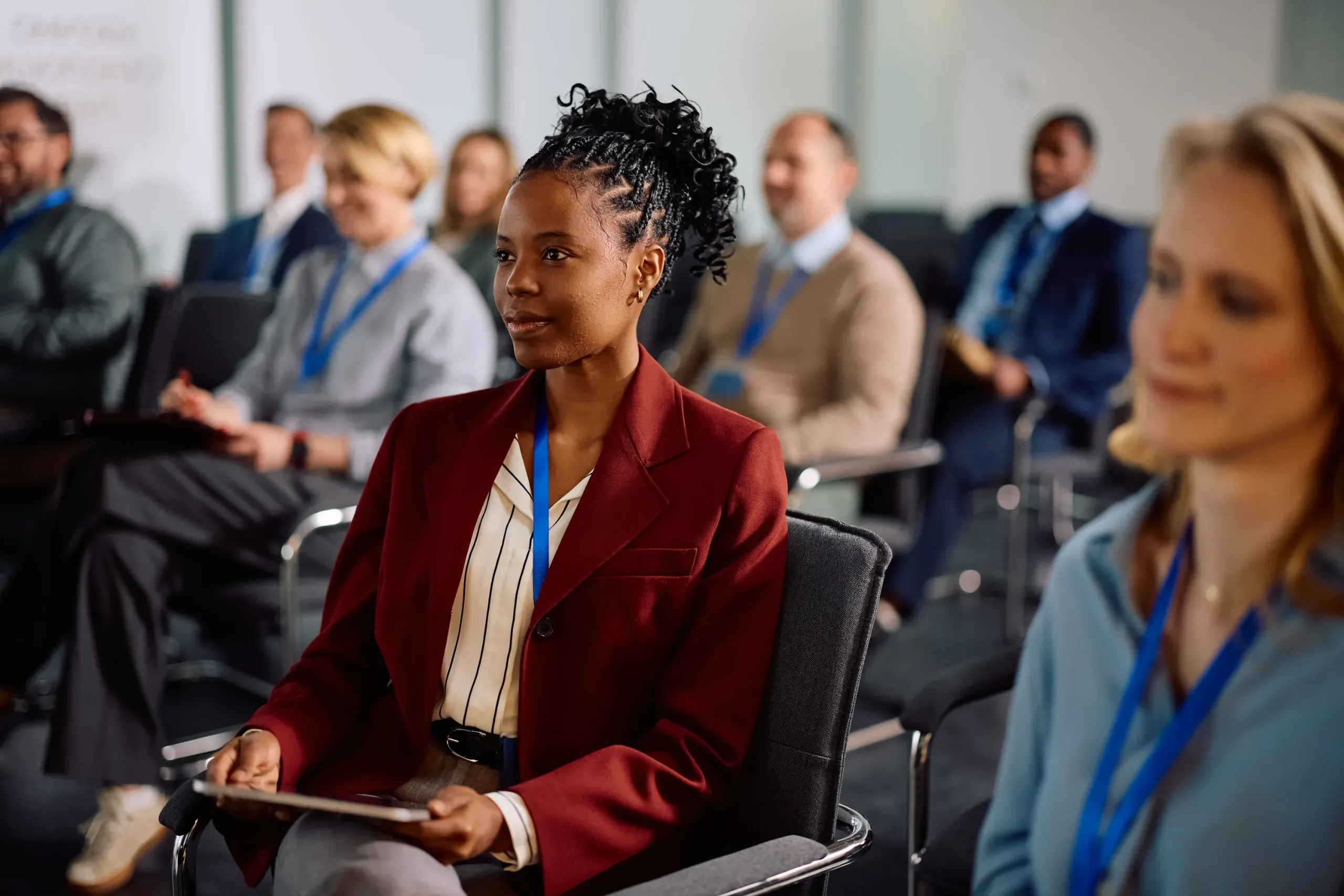 Delegates listening in a conference session