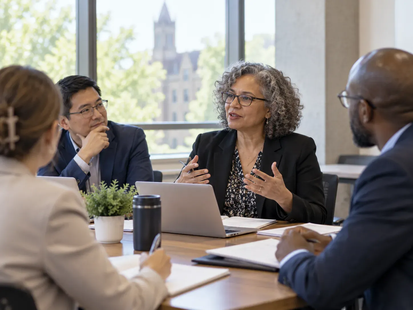 Academics discussing curriculum around a table